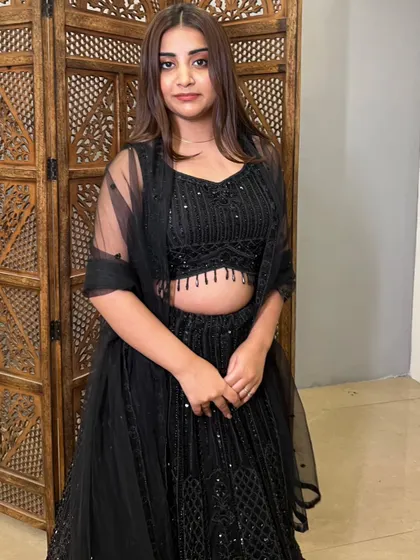 Another look at the classic black sequin lehenga, a timeless choice for any evening event.