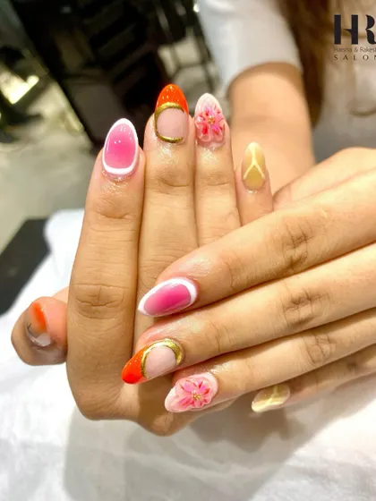 A vibrant and artistic set that showcases a variety of techniques. We combined ombre, a modern French tip, and detailed 3D floral painting to create a truly unique and eye-catching manicure.