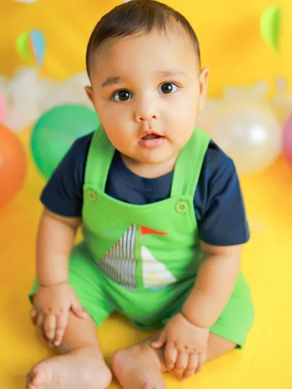 A simple, direct portrait from the same hot air balloon session. His curious eyes and sweet expression are the focus of this beautiful close-up shot.