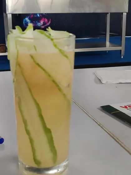 A refreshing mocktail garnished with ribbons of cucumber inside the glass. I create non-alcoholic options that are just as creative and thoughtfully prepared as my alcoholic cocktails.