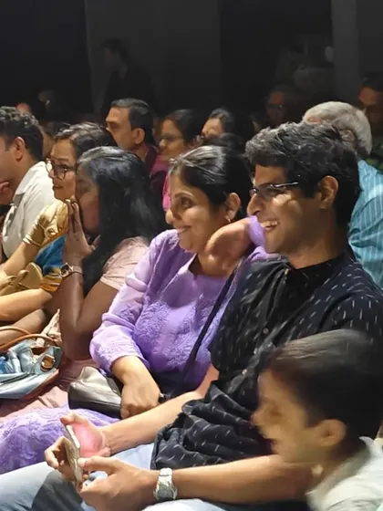 A wide shot of the audience enjoying a children's performance, showing the intimate and supportive atmosphere we foster.