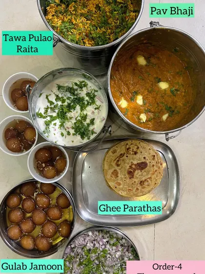 Bowls of warm, syrupy Gulab Jamoon, a perfect end to any Indian meal.