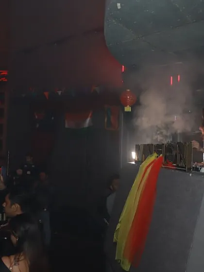 A wide shot of the DJ booth at Mansion, with smoke effects adding to the intense atmosphere of the club.