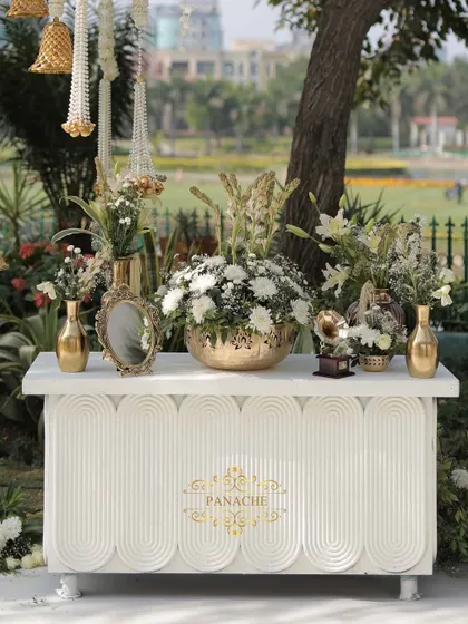 A frontal view of the elegant welcome console, branded with our Panache logo.