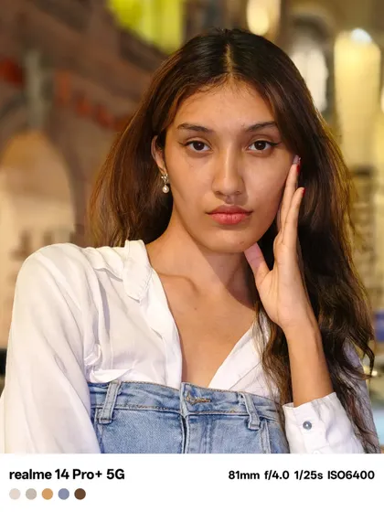 A close up portrait from the same night shoot. Here, the focus is entirely on the subject's gaze, using the warm background lights to add depth and atmosphere.