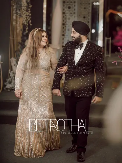 "Betrothal: Two Souls, One Promise." The couple makes their entrance, walking arm-in-arm with loving smiles, ready to begin their forever journey.