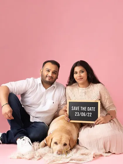 A cute and simple "Save the Date" announcement featuring an expecting couple and their sleepy Labrador. It's a perfect way to let friends and family know when the big day is.