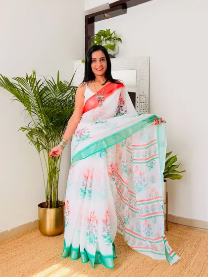 Another lovely tricolor option, this one has a delicate floral print on a white base with a green and saffron border. It's a very elegant and graceful saree for Independence Day.