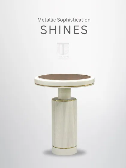 Metallic sophistication shines in this side table. The fluted base, glass top, and brass accents combine to create a piece of modern luxury.