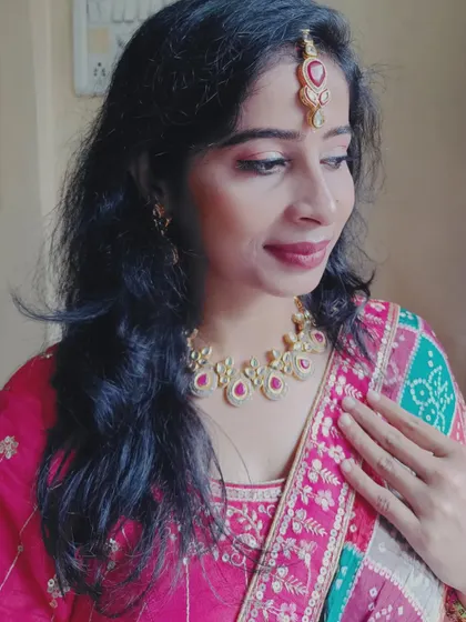 A candid shot showing the elegant details of the jewellery and the festive makeup.