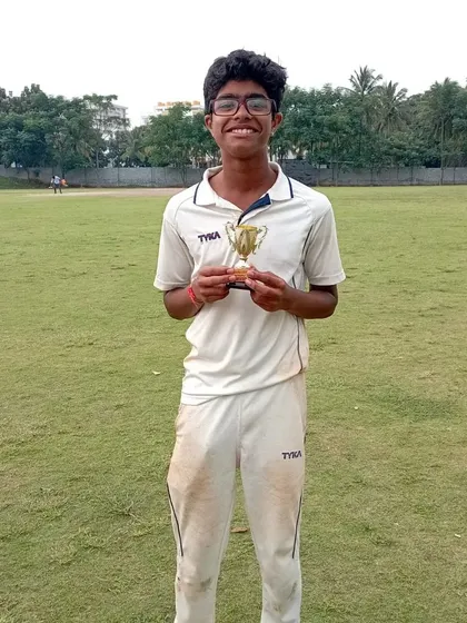Celebrating a standout performance. This young player from our academy proudly holds his trophy after a successful match, showing the results of his hard work and training.