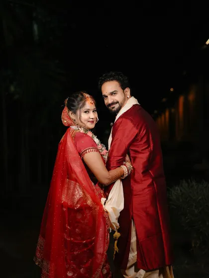 A classic portrait of the couple looking back at the camera, capturing a moment as they begin their new journey together.