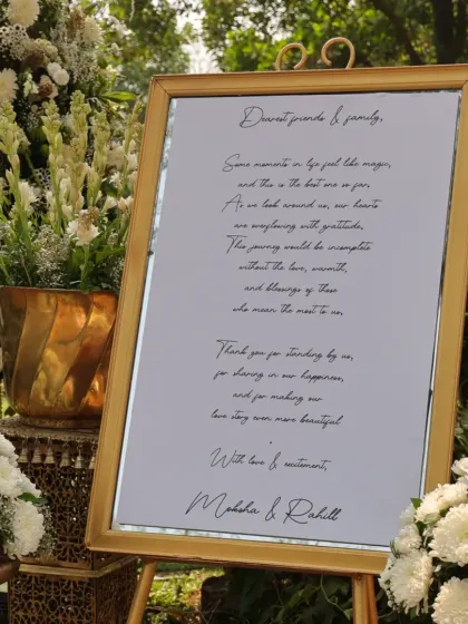 A heartfelt welcome note from the couple to their friends and family, elegantly displayed on a mirrored sign, making guests feel cherished from the moment they arrive.