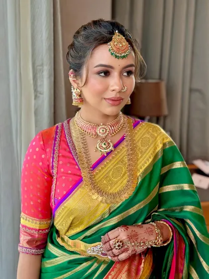 A candid moment showing Deeksha's serene beauty. The makeup is designed to last, looking fresh and perfect throughout the long ceremony.