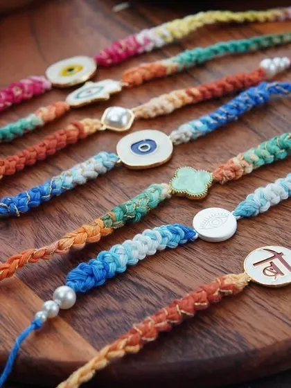 A lineup of all my braided rakhi designs, including the Kundan, evil eye, and clover styles.