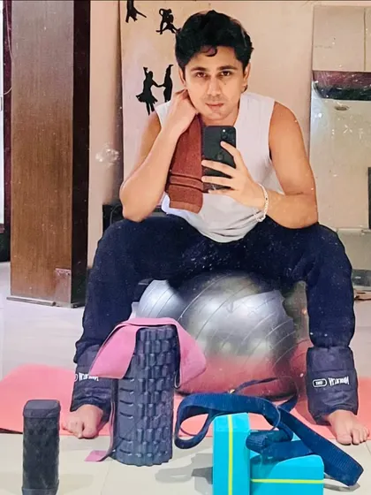 A post-workout selfie, showing the equipment we use in Pilates and functional fitness, including ankle weights and foam rollers for recovery.