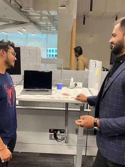 Performing a close-up illusion for an employee at their desk. These intimate moments of magic are perfect for smaller groups and team huddles, sparking curiosity and conversation.