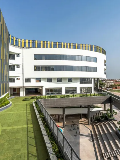 The site for Amity International School, Mohali, presented challenges of size and orientation. We responded by elevating the playground to a podium level, which frees up the ground floor for efficient vehicle circulation while creating ample breakout spaces for students.