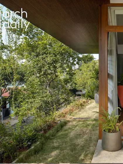 A shot from the ArchDaily feature, showing how the master bedroom terrace overlooks the neighborhood greenery.