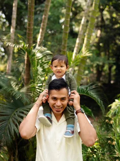 The view from dad's shoulders is the best. I love capturing these playful and loving interactions between a father and his child.