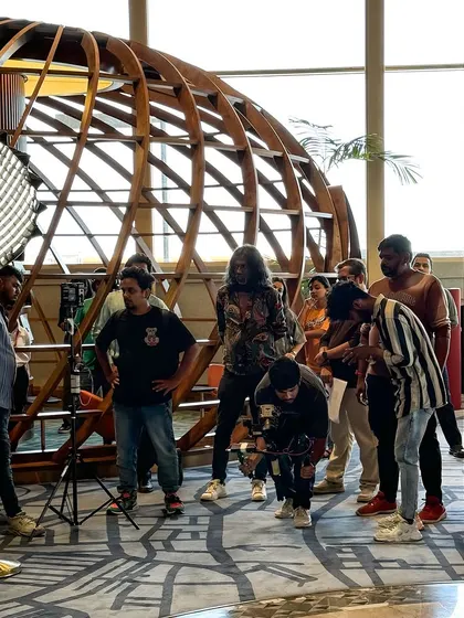 The full crew at work, setting up lighting and camera angles. It takes a big team to make an ad, and I respect and enjoy collaborating with every department.