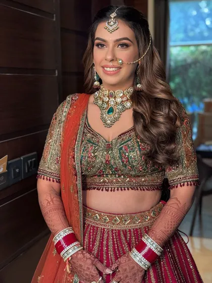 A smiling bride with her hair in soft, romantic waves.