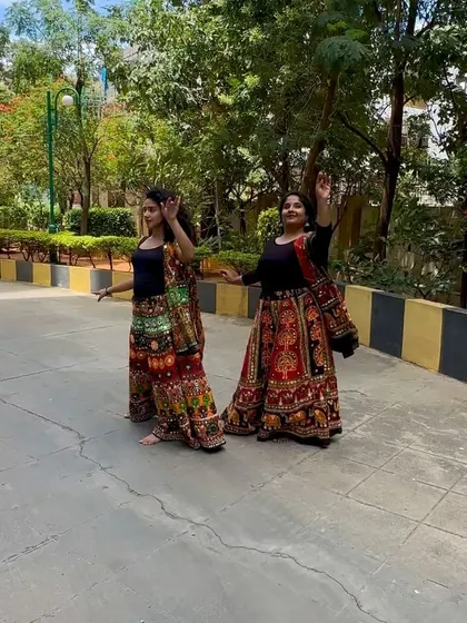 A candid shot from an outdoor Garba dance reel. The colorful traditional skirts and joyful expressions capture the spirit of Navratri.