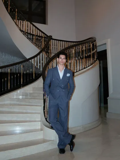 Our client, Vipul Juneja, wears a custom Levelline suit at The Leela Palace. The full-length shot highlights the suit's perfect proportions and timeless style.