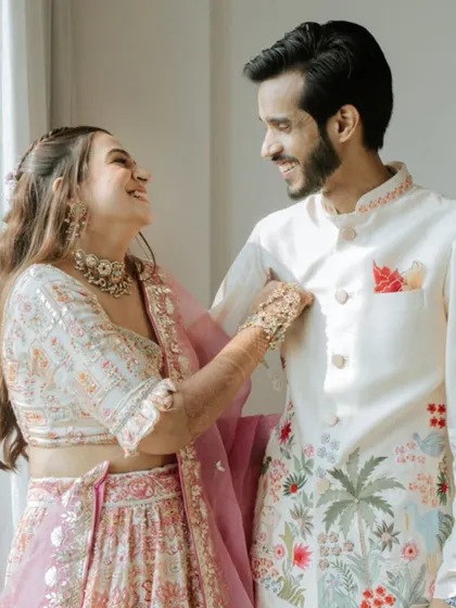 A sweet, candid moment between Karan and Vrinda during their Mehendi ceremony, showcasing their easy chemistry and happiness.
