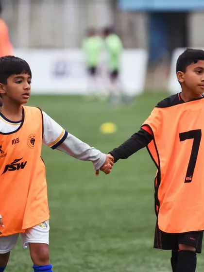 A moment of camaraderie between two young teammates at the BFC Open House.