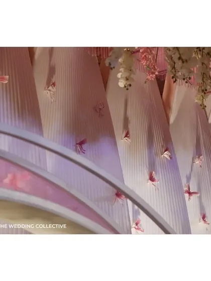 We used twisted, fluted panels with handcrafted butterflies to accent the main backdrop. This detail added texture and a sense of movement, enhancing the 'Midsummer Dream' theme and showcasing our custom fabrication skills.