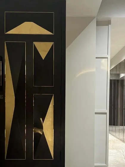The entry door is the first handshake with the home. For this Juhu apartment, I designed a custom door with bold geometric patterns and brass accents to make a powerful first impression.
