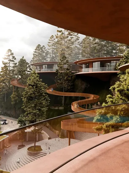 A view from one of the public areas, looking up at the floating villas and the winding skywalk. The design is a testament to how nature can shape architecture.