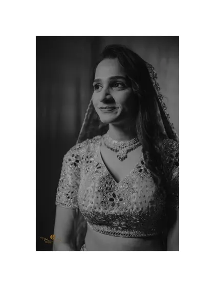A timeless black and white portrait of the bride. Her gentle smile and the classic edit create an image of pure grace.