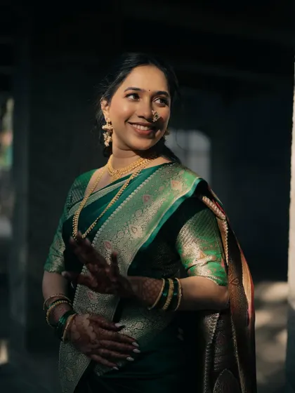 The bride's playful expression is captured perfectly. Her makeup remains flawless and glowing even in candid moments.