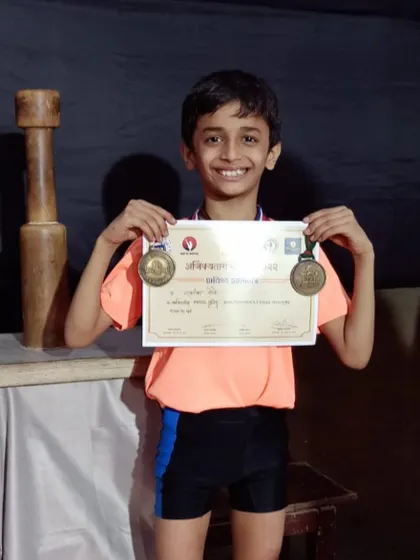 The proudest moments are seeing our students' hard work pay off. Here is our champion Swaransh More, smiling with his well-earned medals and certificate after winning 1st place at the State Selection Mallakhamb Competition.