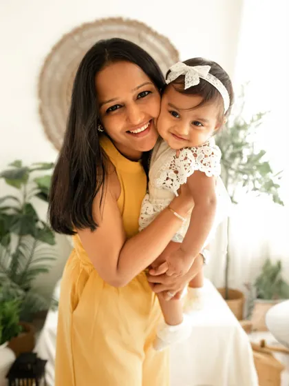 A sweet hug between a mother and her baby girl. Even with a toddler brother in the session, I make sure to capture these precious one-on-one moments.