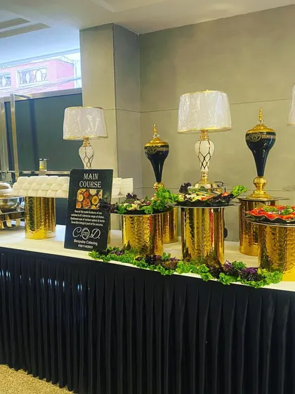 A buffet setup for a luncheon at Rajouri Garden. This shows a more compact but equally elegant arrangement, featuring salad bowls and main courses, suitable for smaller corporate gatherings.