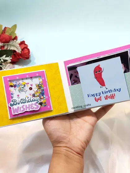 An inside look at the scrapbook from a men's 'Shirt Box' hamper, with a "Birthday Wishes" shaker page.