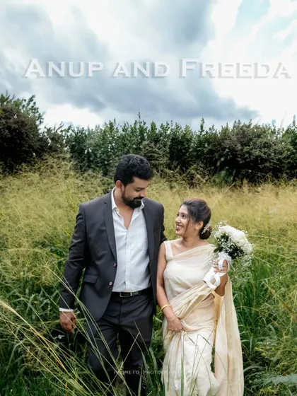 A beautiful outdoor portrait of the couple walking through a field of tall grass, their names elegantly displayed.