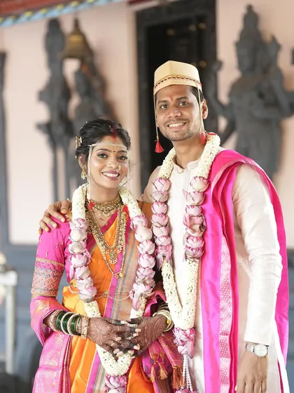 A beautiful couple portrait outside a temple. The bride's makeup is fresh and natural, perfect for a daytime wedding.