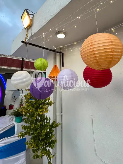 Another angle of the colorful paper lanterns, showing how they can transform any outdoor space. These are perfect for adding a pop of color and a warm glow to birthday parties or evening events.