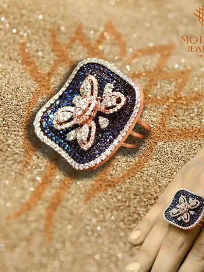 A bold and beautiful cocktail ring featuring a butterfly motif against a backdrop of blue sapphires. This piece is a perfect example of my creative and imaginative design approach.