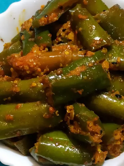 This is my stuffed Green Chilli Pickle, seen up close. You can see the texture of the spice filling, which complements the fresh crunch of the green chillies.