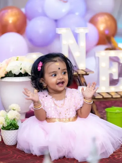 Such a happy little princess celebrating her first birthday. We love capturing these expressive moments of clapping and laughter during our studio sessions.