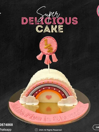 A lovely rainbow-themed cake for a six-month celebration. This design is shaped like a rainbow with a heart in the center and is personalized with the baby's name and milestone.