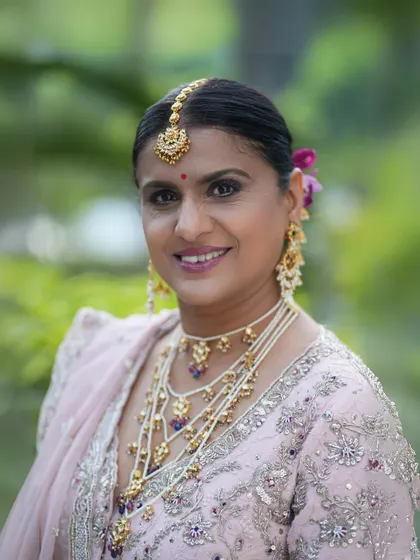 Another smiling portrait that captures the joy of the day. The soft glam makeup is perfect for enhancing her natural beauty.