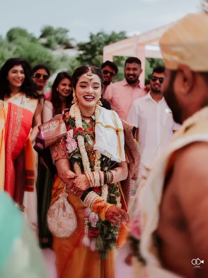 The bride's joyful reaction as she sees her groom for the first time at the ceremony.
