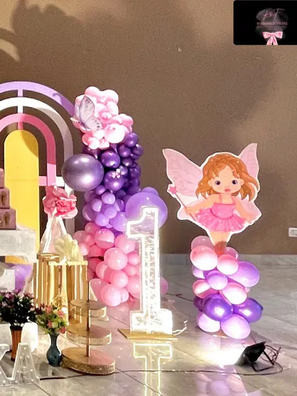 An identical shot of the light-up number '1' and fairy prop.