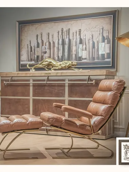 This leather lounge chair and ottoman set is designed for pure relaxation. Its ergonomic form and plush upholstery offer a luxurious escape, proving that comfortable seating can also be exceptionally stylish.